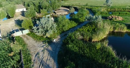 Drone View of Woman Riding Bicycle in Countryside