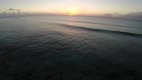 Paddleboarding into a Beautiful Sunrise in the Ocean