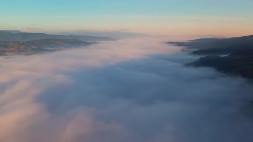 4K Sun is rising above sea of clouds until the horizon