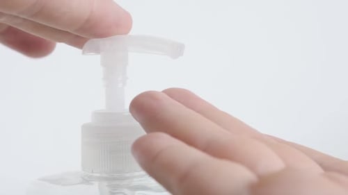 Sanitizer gel on alcohol base taken by fingers close-up footage