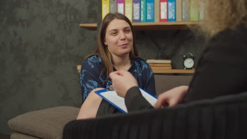 Woman Talking with Therapist in Home Office