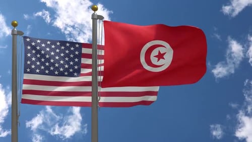 United States and Tunisia Flags Waving in Blue Sky