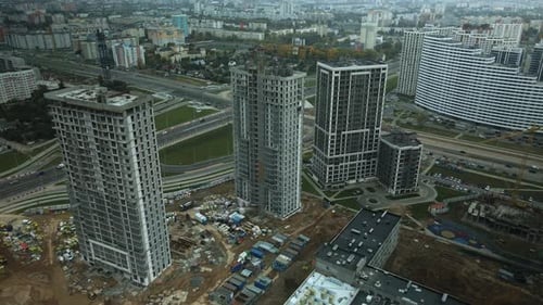 Construction of modern multi-storey buildings. Construction of a new city block.