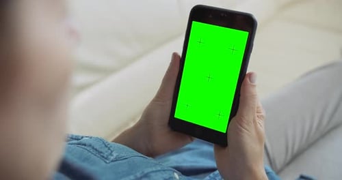 Woman Holds Phone With Green Screen