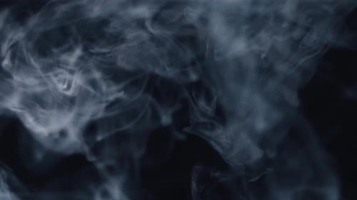 Dynamic White Smoke Flowing on a Dark Abstract Background