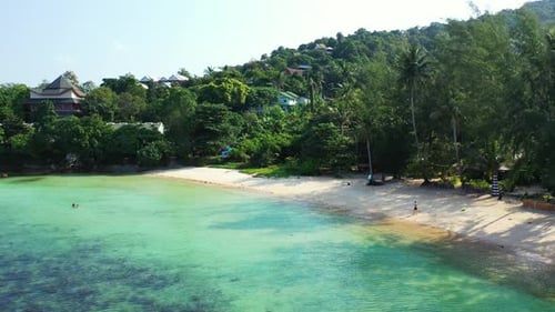 Aerial top view travel of exotic bay beach break by blue green lagoon with clean sand background of