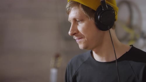 Guy In Knit Cap Playing Drums