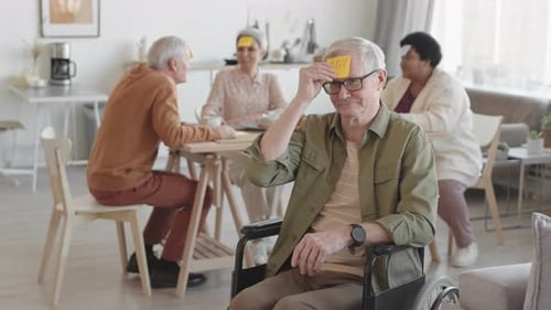 Senior Friends Enjoying a Fun Game at Home