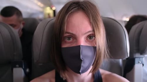 Woman Wearing Face Mask on Airplane
