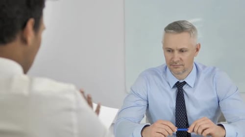 Business Meeting in Modern Office Setting