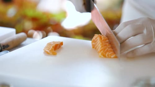 Close Up of Salmon Being Cut
