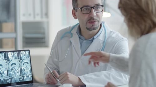 Doctor Explains Brain Scan to Patient