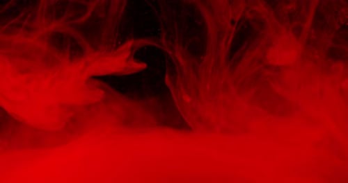 Abstract Red Ink Splatter on Dark Background