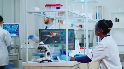 Woman Scientist Working in Modern Lab