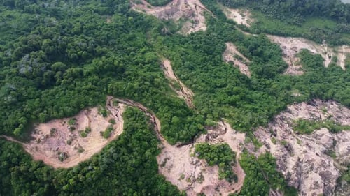 Aerial rotation view deforestation red clay soil mining quarry