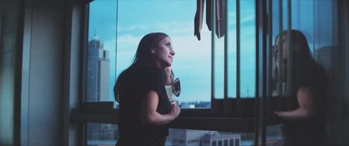Woman Taking Photos with Camera Inside Apartment