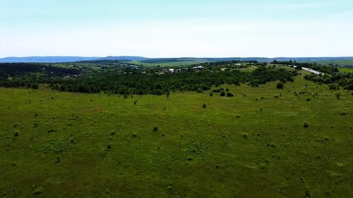 Aerial drone view of a flying over the rural agricultural landscape.