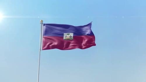Haiti Flag Waving Under Bright Blue Sky