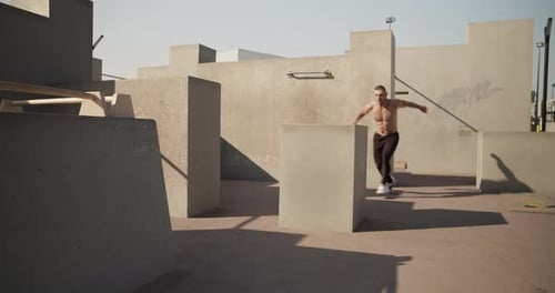 Sportsman Practicing Parkour on Street