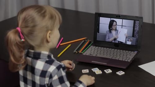 Child Learning During Online Class on Laptop