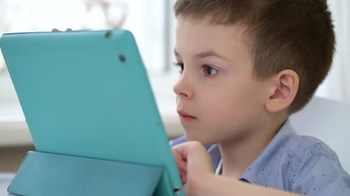 Child Using Tablet at Home, Close-Up
