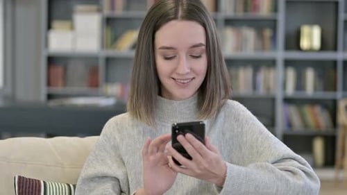Portrait of Attractive Young Woman Using Smartphone
