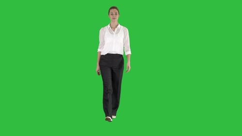 Woman Walking in Formal Outfit on A Green Screen, Chroma Key.
