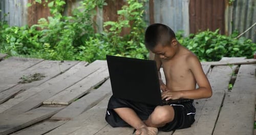 Rural Boy Using Laptop
