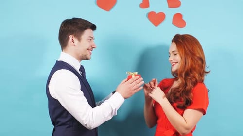 Man Giving Gift to a Happy Woman