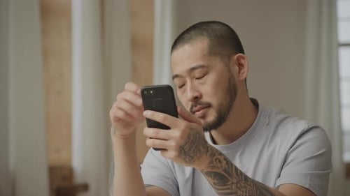 Close Up of a Man Recieving Bad News on His Smart Phone in Slow Motion