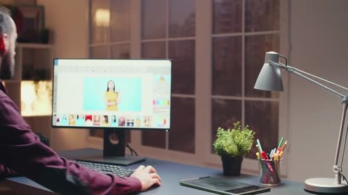 Man Editing Photos Late at Night on Computer