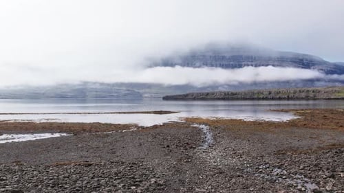 Drone Flight Towards River Mist And Mountain