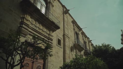 Antique Building Facade with Balconies in City