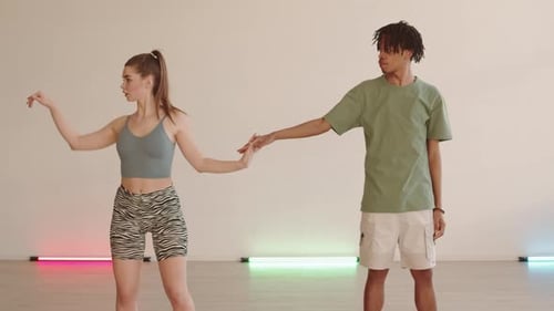 Woman and Man Dancing in Studio