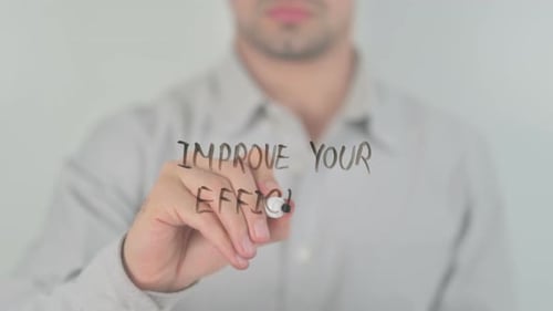 Man Writing Improve Your Efficiency on Glass