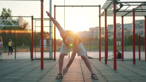 Elderly Caucasian Man Making Fitness Exercises After Coronavirus Virus Pandemic in Park. Workout for