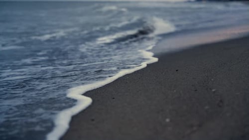 Water Tide Breaking Beach on Sunset Nature Shore