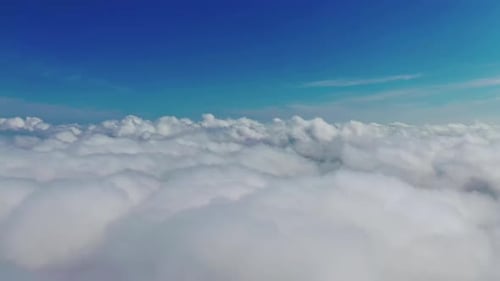 Aerial View of Clouds Meeting Blue Sky