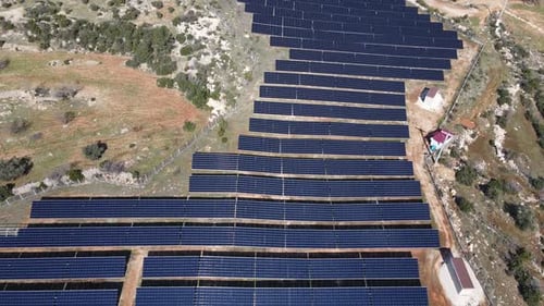 Aerial View of Solar Panel Farm in Rural Area