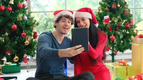 Couple Video Calling on Tablet at Christmas