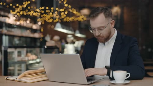 Businessman Typing on Laptop