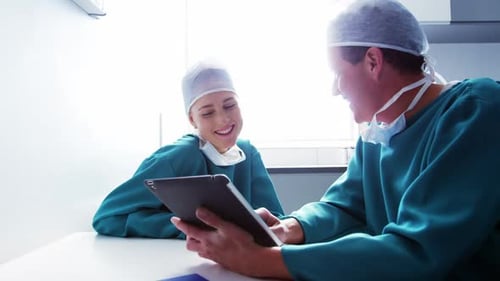 Medical Staff Using Tablet in Hospital Office