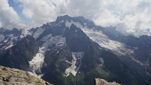 The Rocky Mountains Were Shrouded in Clouds on a Sunny Day
