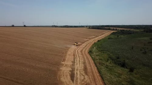 Aerial View of Combine Harvesters Agricultural Machinery. The Machine for Harvesting Grain Crops