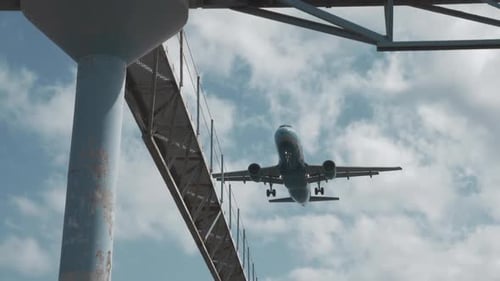 Plane Descending Over the City for Final Approach