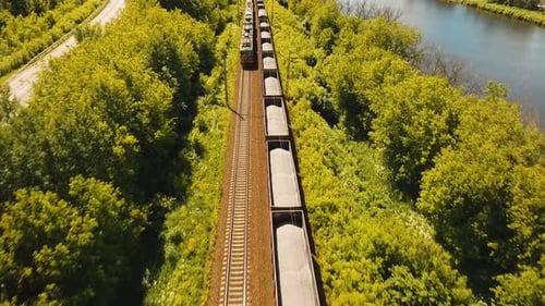 Freight Train Journey Through Lush Green Countryside
