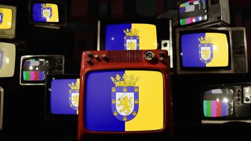 Collection of Vintage TVs Displaying Static and a Flag