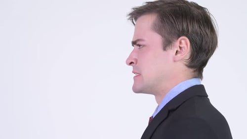 Profile View of Young Angry Businessman Shouting