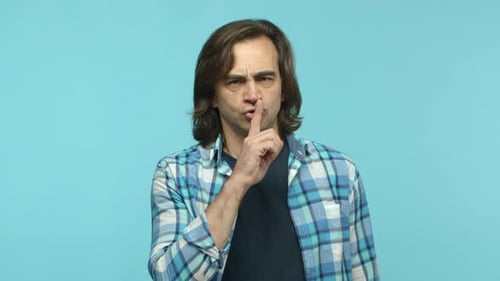 Slow Motion of Angry Middleaged Man Frowning and Shushing with Disapproval Telling to Be Quiet