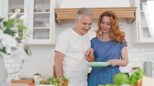 Couple Cooking Together in Home Kitchen